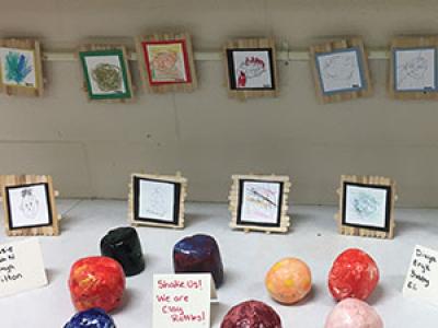 display of student pottery and sketches 
